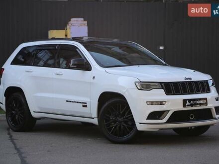Белый Джип Гранд Чероки, объемом двигателя 5.65 л и пробегом 80 тыс. км за 35900 $, фото 1 на Automoto.ua