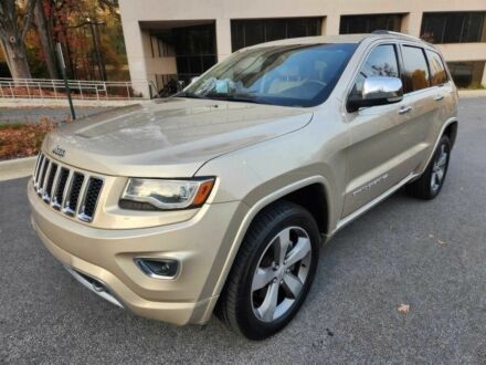 Бежевий Джип Grand Cherokee, об'ємом двигуна 5.7 л та пробігом 86 тис. км за 9500 $, фото 1 на Automoto.ua