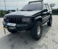 Черный Джип Гранд Чероки, объемом двигателя 5.2 л и пробегом 300 тыс. км за 7500 $, фото 1 на Automoto.ua