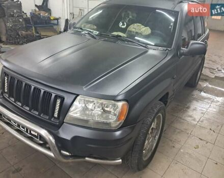 Чорний Джип Grand Cherokee, об'ємом двигуна 4 л та пробігом 294 тис. км за 5000 $, фото 1 на Automoto.ua