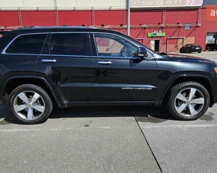 Черный Джип Гранд Чероки, объемом двигателя 5.65 л и пробегом 180 тыс. км за 22500 $, фото 4 на Automoto.ua