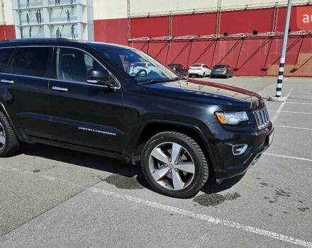 Черный Джип Гранд Чероки, объемом двигателя 5.65 л и пробегом 180 тыс. км за 22500 $, фото 5 на Automoto.ua