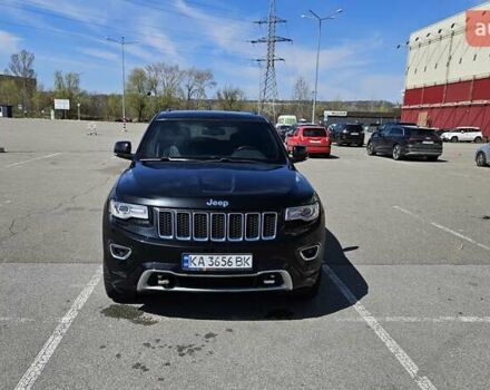 Черный Джип Гранд Чероки, объемом двигателя 5.65 л и пробегом 180 тыс. км за 22500 $, фото 1 на Automoto.ua