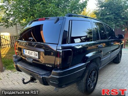 Черный Джип Гранд Чероки, объемом двигателя 2.7 л и пробегом 300 тыс. км за 5000 $, фото 1 на Automoto.ua