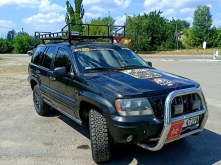 Джип Grand Cherokee 2003 у Изюме на Automoto.ua Чорний Джип Grand Cherokee, об'ємом двигуна 2.7 л та пробігом 335 тис. км за 5000 $, фото 1 на Automoto.ua