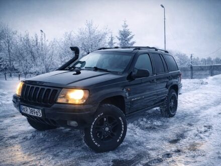 Черный Джип Гранд Чероки, объемом двигателя 3 л и пробегом 270 тыс. км за 5700 $, фото 1 на Automoto.ua
