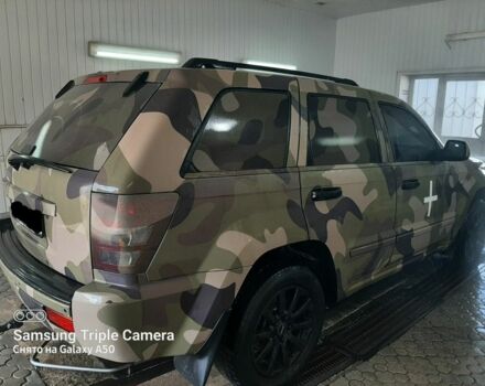 Чорний Джип Grand Cherokee, об'ємом двигуна 3 л та пробігом 415 тис. км за 14000 $, фото 1 на Automoto.ua