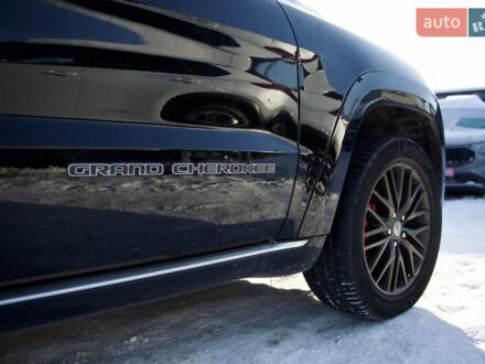 Черный Джип Гранд Чероки, объемом двигателя 5.65 л и пробегом 130 тыс. км за 29999 $, фото 1 на Automoto.ua