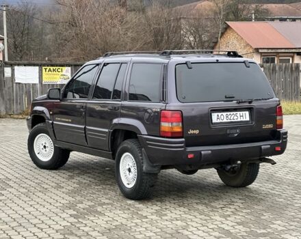 Фиолетовый Джип Гранд Чероки, объемом двигателя 2.5 л и пробегом 300 тыс. км за 5200 $, фото 2 на Automoto.ua