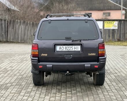 Фиолетовый Джип Гранд Чероки, объемом двигателя 2.5 л и пробегом 300 тыс. км за 5200 $, фото 7 на Automoto.ua