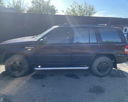 Красный Джип Гранд Чероки, объемом двигателя 5.2 л и пробегом 270 тыс. км за 3100 $, фото 3 на Automoto.ua