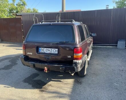 Красный Джип Гранд Чероки, объемом двигателя 5.2 л и пробегом 270 тыс. км за 3100 $, фото 4 на Automoto.ua