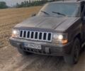 Красный Джип Гранд Чероки, объемом двигателя 5.2 л и пробегом 270 тыс. км за 3350 $, фото 1 на Automoto.ua