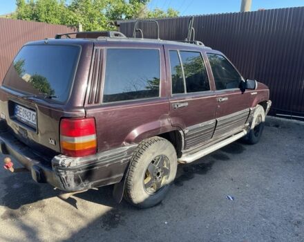 Красный Джип Гранд Чероки, объемом двигателя 5.2 л и пробегом 270 тыс. км за 3100 $, фото 1 на Automoto.ua