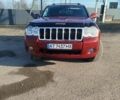 Красный Джип Гранд Чероки, объемом двигателя 2.99 л и пробегом 330 тыс. км за 11400 $, фото 1 на Automoto.ua