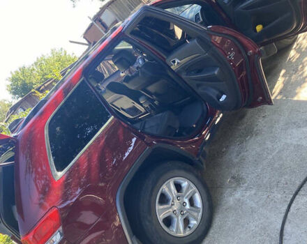 Красный Джип Гранд Чероки, объемом двигателя 3.6 л и пробегом 157 тыс. км за 25300 $, фото 1 на Automoto.ua