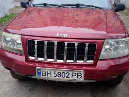 Красный Джип Гранд Чероки, объемом двигателя 2.69 л и пробегом 300 тыс. км за 6000 $, фото 1 на Automoto.ua