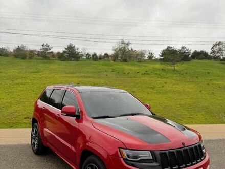 Красный Джип Гранд Чероки, объемом двигателя 6.4 л и пробегом 177 тыс. км за 31900 $, фото 1 на Automoto.ua