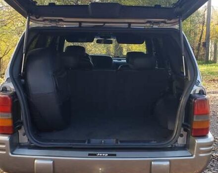Сірий Джип Grand Cherokee, об'ємом двигуна 5.9 л та пробігом 216 тис. км за 10000 $, фото 6 на Automoto.ua