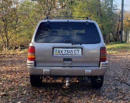 Сірий Джип Grand Cherokee, об'ємом двигуна 5.9 л та пробігом 216 тис. км за 10000 $, фото 3 на Automoto.ua