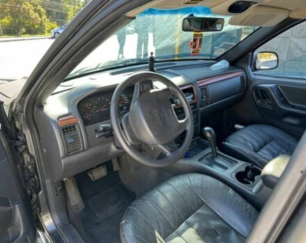 Серый Джип Гранд Чероки, объемом двигателя 4 л и пробегом 296 тыс. км за 2999 $, фото 2 на Automoto.ua