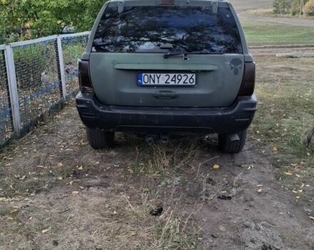 Джип Гранд Чероки 2003 в Новониколаевке на Automoto.ua Серый Джип Гранд Чероки, объемом двигателя 2.7 л и пробегом 348 тыс. км за 5200 $, фото 3 на Automoto.ua