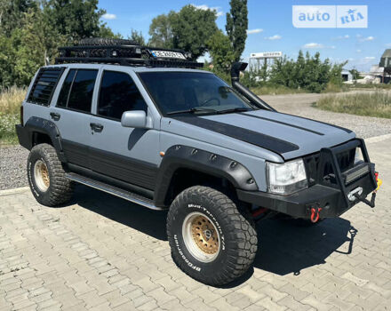 Сірий Джип Grand Cherokee, об'ємом двигуна 5.21 л та пробігом 200 тис. км за 12999 $, фото 1 на Automoto.ua