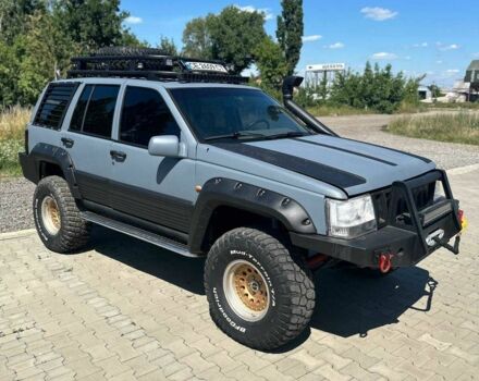 Сірий Джип Grand Cherokee, об'ємом двигуна 5.2 л та пробігом 200 тис. км за 12999 $, фото 1 на Automoto.ua