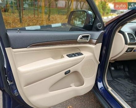 Синий Джип Гранд Чероки, объемом двигателя 5.65 л и пробегом 128 тыс. км за 27400 $, фото 1 на Automoto.ua