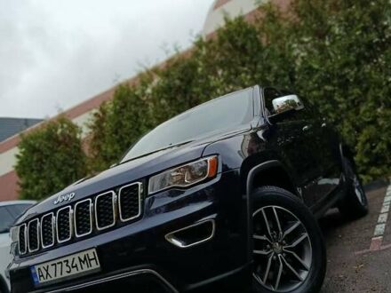 Синий Джип Гранд Чероки, объемом двигателя 5.65 л и пробегом 128 тыс. км за 27400 $, фото 1 на Automoto.ua