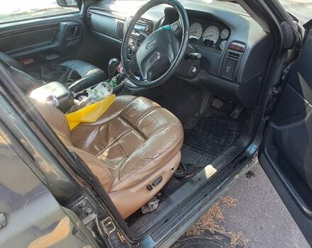 Зеленый Джип Гранд Чероки, объемом двигателя 2.7 л и пробегом 2 тыс. км за 3500 $, фото 1 на Automoto.ua