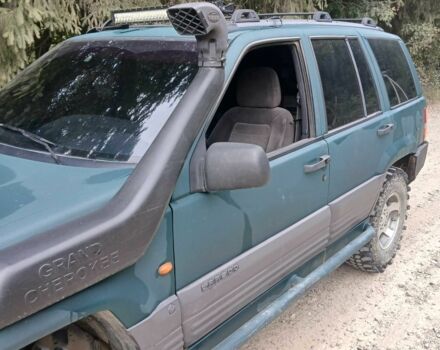 Зеленый Джип Гранд Чероки, объемом двигателя 2.5 л и пробегом 312 тыс. км за 9600 $, фото 4 на Automoto.ua