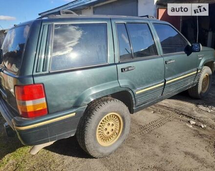 Зелений Джип Grand Cherokee, об'ємом двигуна 5.2 л та пробігом 140 тис. км за 6499 $, фото 3 на Automoto.ua