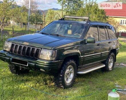 Зелений Джип Grand Cherokee, об'ємом двигуна 5.2 л та пробігом 320 тис. км за 5250 $, фото 5 на Automoto.ua