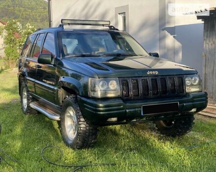 Зелений Джип Grand Cherokee, об'ємом двигуна 5.2 л та пробігом 320 тис. км за 5250 $, фото 3 на Automoto.ua