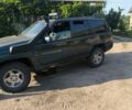 Зелений Джип Grand Cherokee, об'ємом двигуна 2.5 л та пробігом 300 тис. км за 1999 $, фото 1 на Automoto.ua