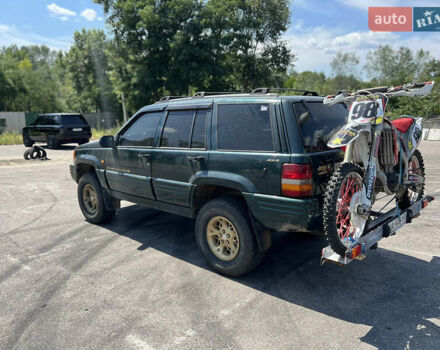 Зелений Джип Grand Cherokee, об'ємом двигуна 5.2 л та пробігом 140 тис. км за 6000 $, фото 3 на Automoto.ua