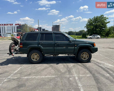 Зелений Джип Grand Cherokee, об'ємом двигуна 5.2 л та пробігом 140 тис. км за 6000 $, фото 1 на Automoto.ua
