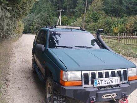 Зелений Джип Grand Cherokee, об'ємом двигуна 2.5 л та пробігом 312 тис. км за 9600 $, фото 1 на Automoto.ua