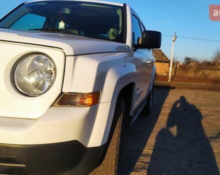 Белый Джип Патриот, объемом двигателя 2.4 л и пробегом 160 тыс. км за 12000 $, фото 1 на Automoto.ua