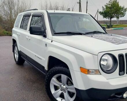 Білий Джип Patriot, об'ємом двигуна 2.4 л та пробігом 113 тис. км за 11300 $, фото 1 на Automoto.ua
