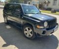 Черный Джип Патриот, объемом двигателя 2.4 л и пробегом 250 тыс. км за 5900 $, фото 1 на Automoto.ua
