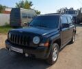 Черный Джип Патриот, объемом двигателя 2.36 л и пробегом 259 тыс. км за 8500 $, фото 1 на Automoto.ua