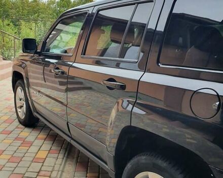 Черный Джип Патриот, объемом двигателя 2.36 л и пробегом 155 тыс. км за 10500 $, фото 1 на Automoto.ua