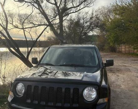 Черный Джип Патриот, объемом двигателя 2.36 л и пробегом 144 тыс. км за 10500 $, фото 1 на Automoto.ua