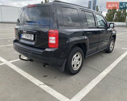 Черный Джип Патриот, объемом двигателя 2.36 л и пробегом 143 тыс. км за 10900 $, фото 1 на Automoto.ua