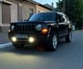 Черный Джип Патриот, объемом двигателя 2.4 л и пробегом 84 тыс. км за 15000 $, фото 1 на Automoto.ua