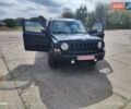 Черный Джип Патриот, объемом двигателя 2.4 л и пробегом 182 тыс. км за 10400 $, фото 1 на Automoto.ua