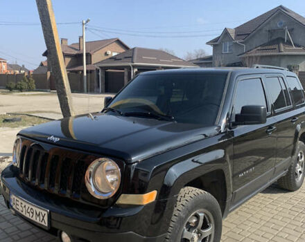 Черный Джип Патриот, объемом двигателя 2.4 л и пробегом 200 тыс. км за 12000 $, фото 1 на Automoto.ua
