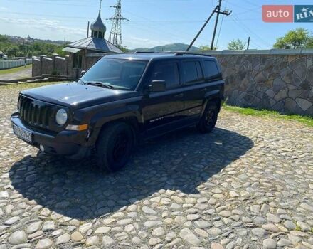 Черный Джип Патриот, объемом двигателя 2.36 л и пробегом 210 тыс. км за 8400 $, фото 1 на Automoto.ua